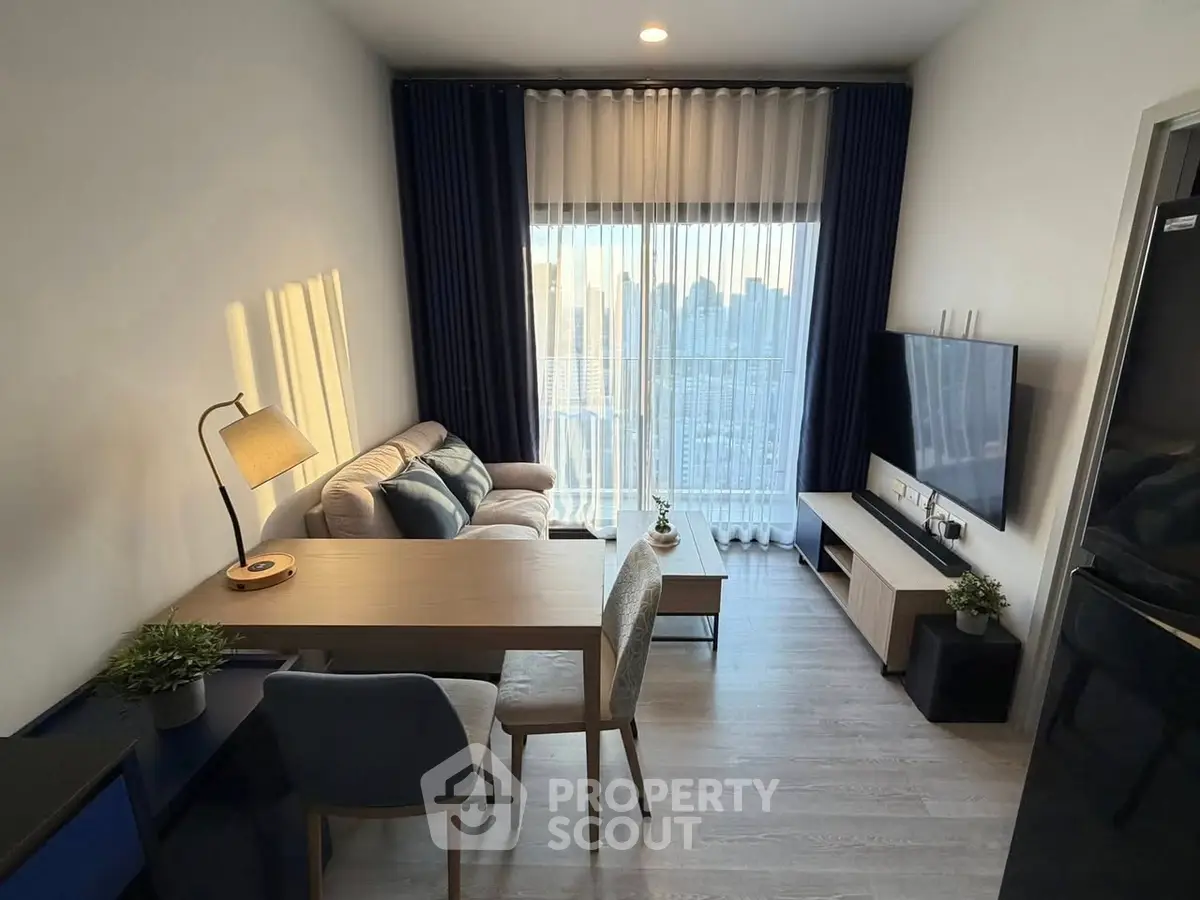 Modern living room with city view, stylish furniture, and natural light