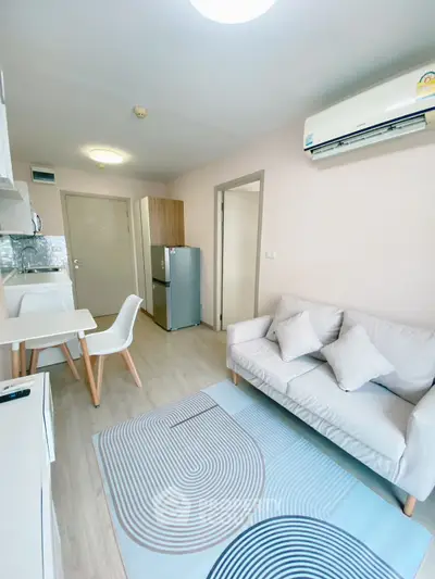 Modern living room with cozy sofa and dining area in bright apartment