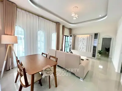 Modern living room with elegant dining area and stylish decor