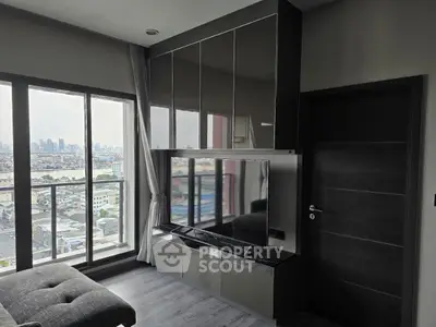 Modern living room with city view and sleek entertainment unit