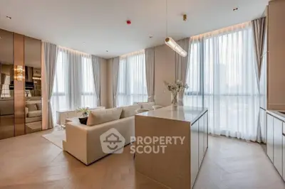 Luxurious modern living room with open kitchen and large windows offering stunning city views.