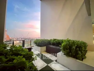 Modern balcony with panoramic city view and lush greenery