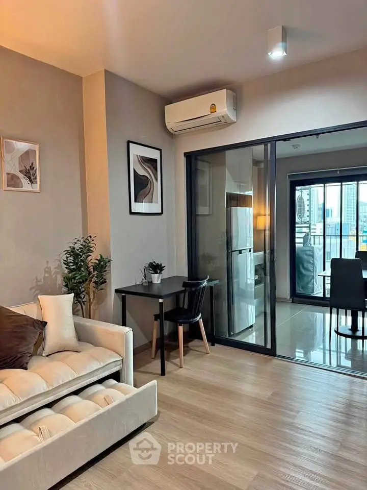 Modern living room with stylish decor and balcony view in urban apartment