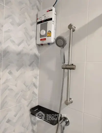Modern bathroom shower with sleek fixtures and water heater.