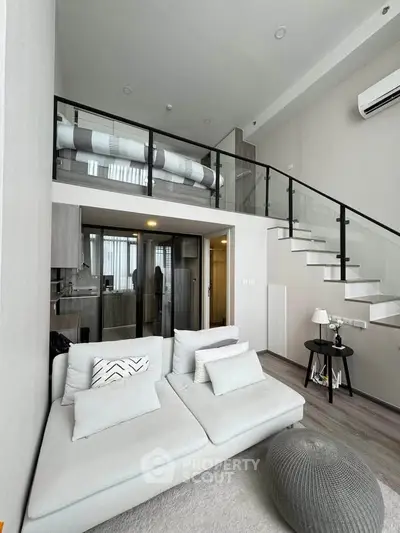 Modern loft apartment with stylish mezzanine and cozy living area