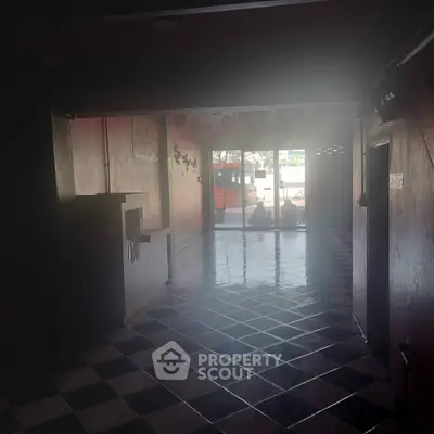 Spacious interior with glossy tiled floor and large window