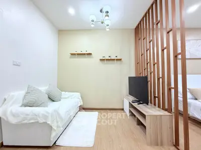 Modern living room with stylish wooden partition and cozy sofa