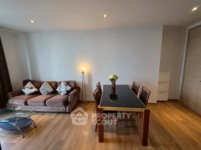Modern living room with elegant dining set and cozy sofa