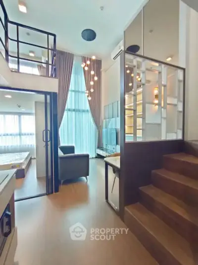 Modern loft apartment with high ceilings and stylish interior design, featuring a cozy living area and elegant lighting.