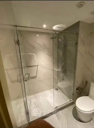 Modern bathroom with glass shower enclosure and sleek design