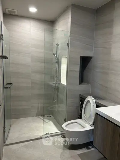 Modern bathroom with sleek glass shower and contemporary fixtures