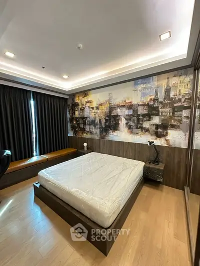 Modern bedroom with artistic wall mural and cozy lighting