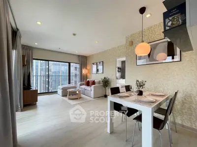 Spacious modern living room with dining area and large windows offering city views.