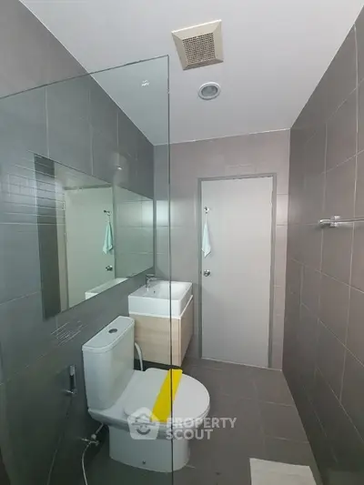 Modern bathroom with sleek design and glass shower partition