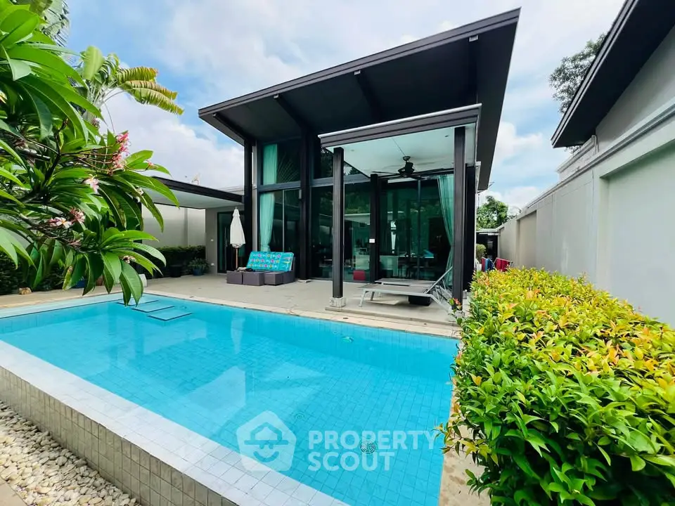 Luxurious modern villa with private pool and lush garden, perfect for serene living.