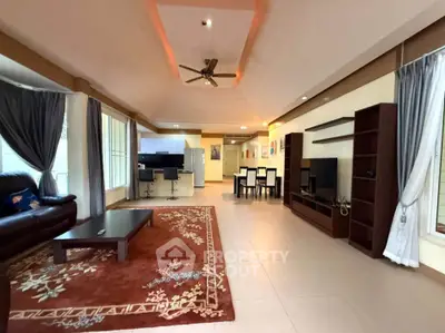 Spacious open-plan living room with modern furnishings and elegant decor