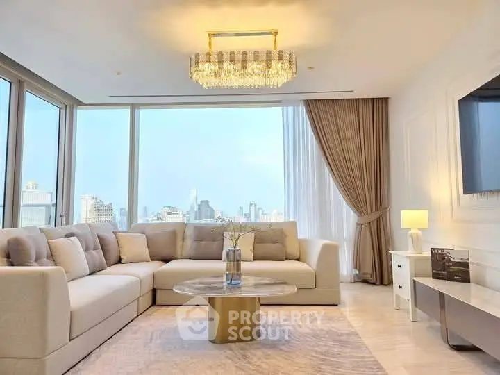 Luxurious living room with panoramic city view and elegant chandelier