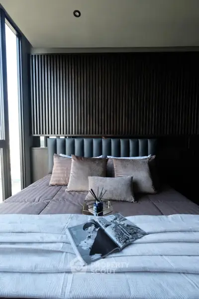 Luxurious modern bedroom with plush pillows and stylish decor