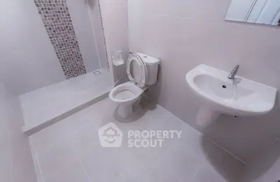 Modern bathroom with sleek fixtures and walk-in shower
