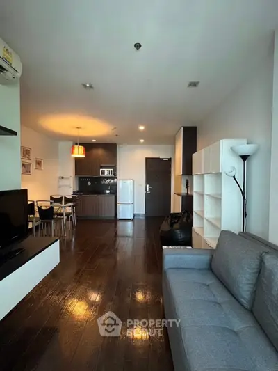 Modern living room with open kitchen and stylish decor