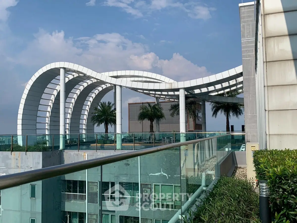 Stunning rooftop view with modern architectural design and lush greenery, perfect for urban living.