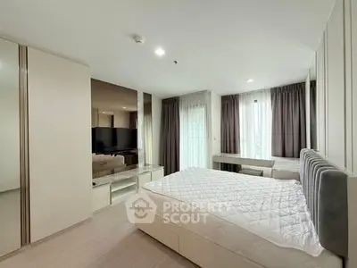 Spacious modern bedroom with large windows and elegant decor