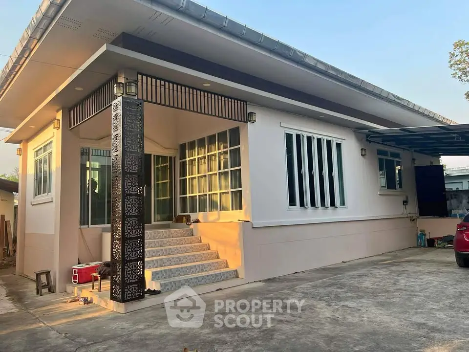 Charming single-story home with modern design and spacious driveway