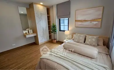 Elegant bedroom with cozy decor and natural light