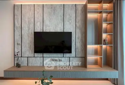 Modern living room with sleek TV wall unit and ambient lighting