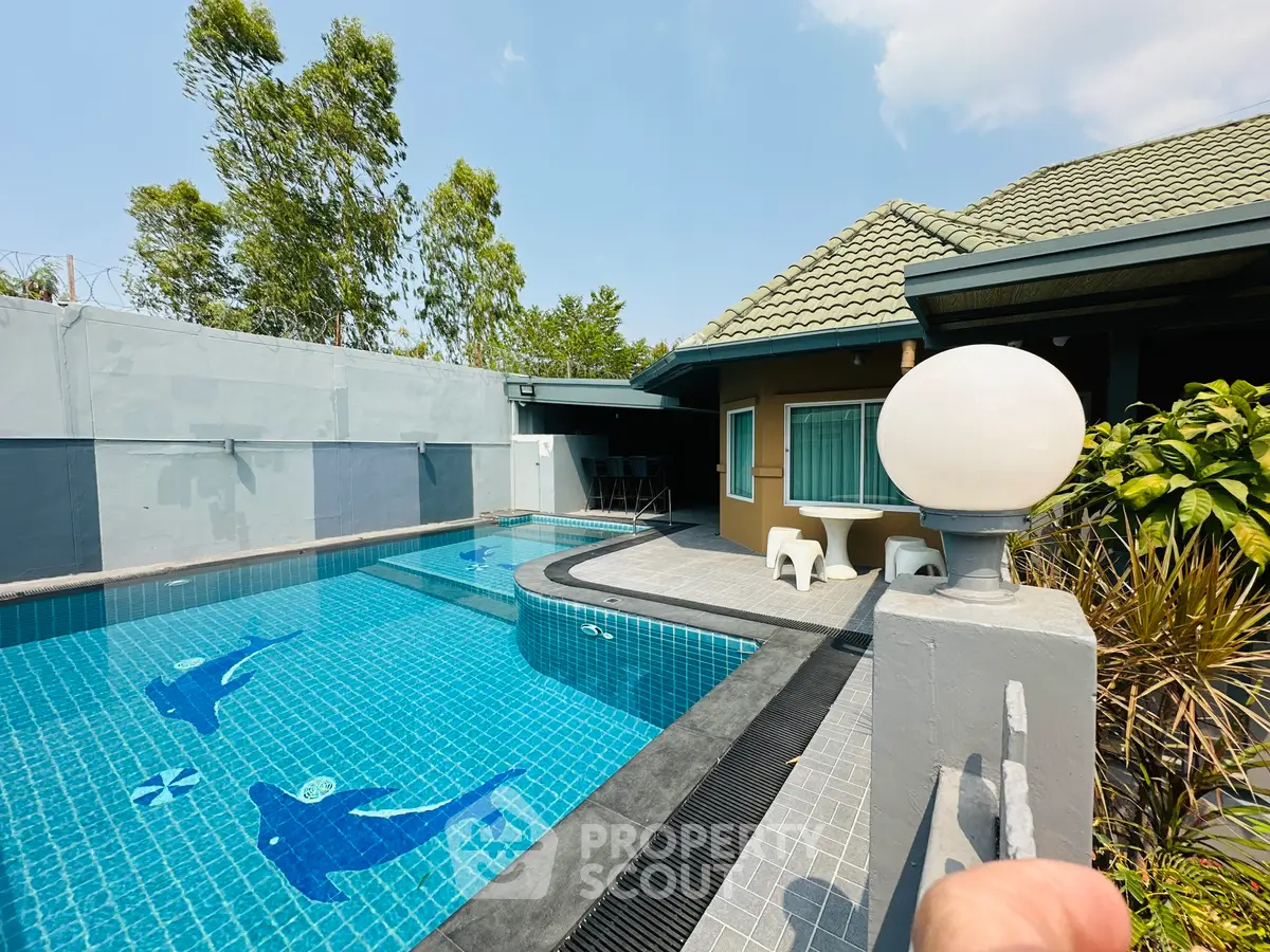 Stunning private pool area with modern design and lush greenery, perfect for relaxation and entertainment.