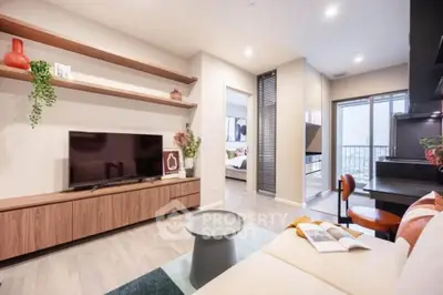 Modern living room with stylish decor, open layout, and balcony access in a contemporary apartment.
