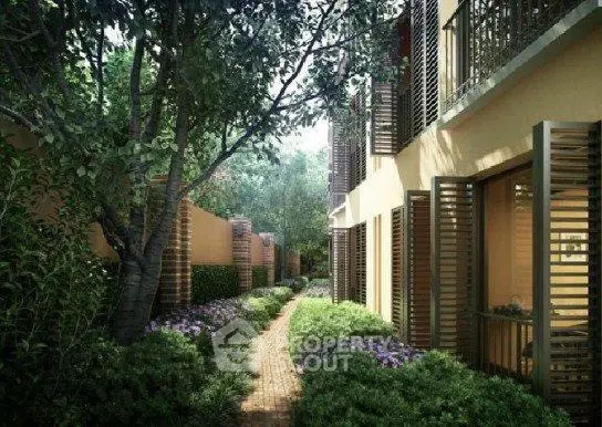 Charming garden pathway with lush greenery and elegant building facade