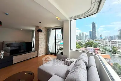 Spacious living room with stunning city view and modern decor