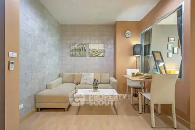 Modern living room with stylish decor and cozy dining area in an open layout apartment.