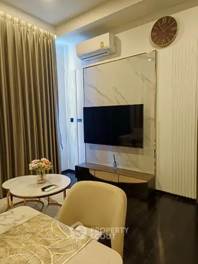 Elegant living room with modern TV setup and stylish decor