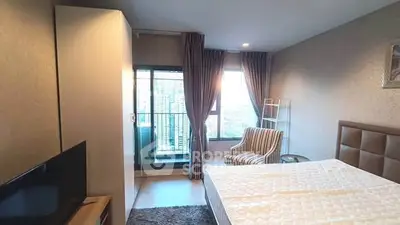 Modern bedroom with balcony view in high-rise apartment