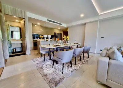 Spacious open-plan living and dining area with modern decor and elegant furnishings.