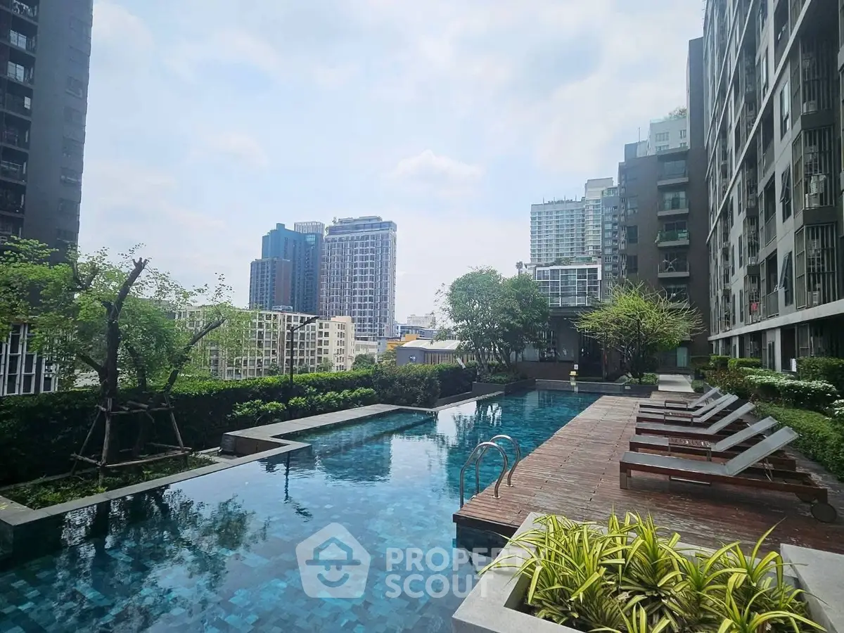 Luxurious rooftop pool with stunning cityscape views in modern urban apartment complex.