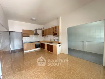 Spacious kitchen with open layout and modern cabinetry