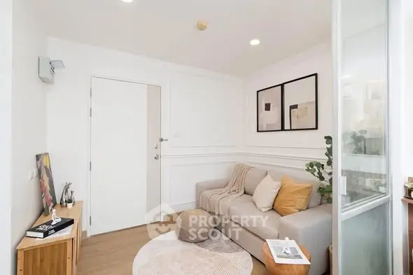 Chic modern living room with cozy sofa and stylish decor in bright apartment.