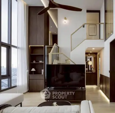 Luxurious modern living room with high ceilings and large windows offering stunning city views.