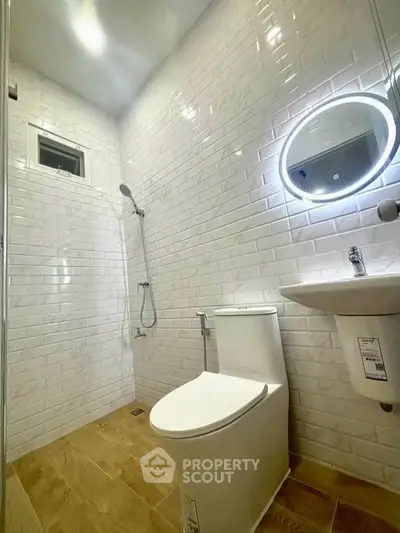 Modern bathroom with sleek fixtures and stylish white subway tiles