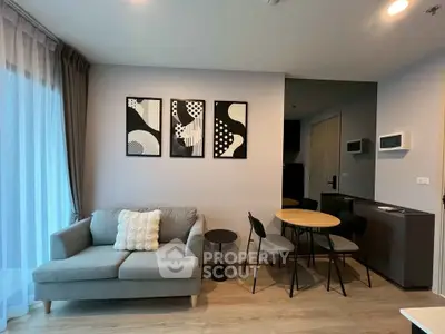Modern living room with stylish decor and cozy seating area in a contemporary apartment.