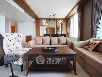 Spacious living room with elegant sofas and natural light