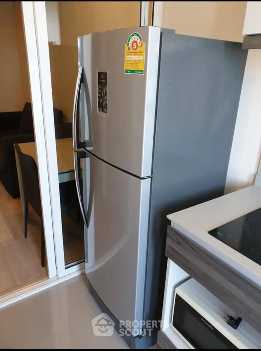 Modern kitchen with sleek stainless steel refrigerator and built-in oven