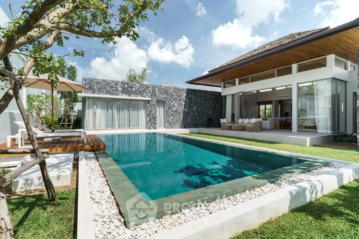 Luxurious modern villa with private pool and lush garden, perfect for serene living.