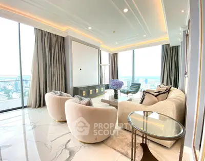 Luxurious high-rise living room with panoramic city views and elegant modern decor.