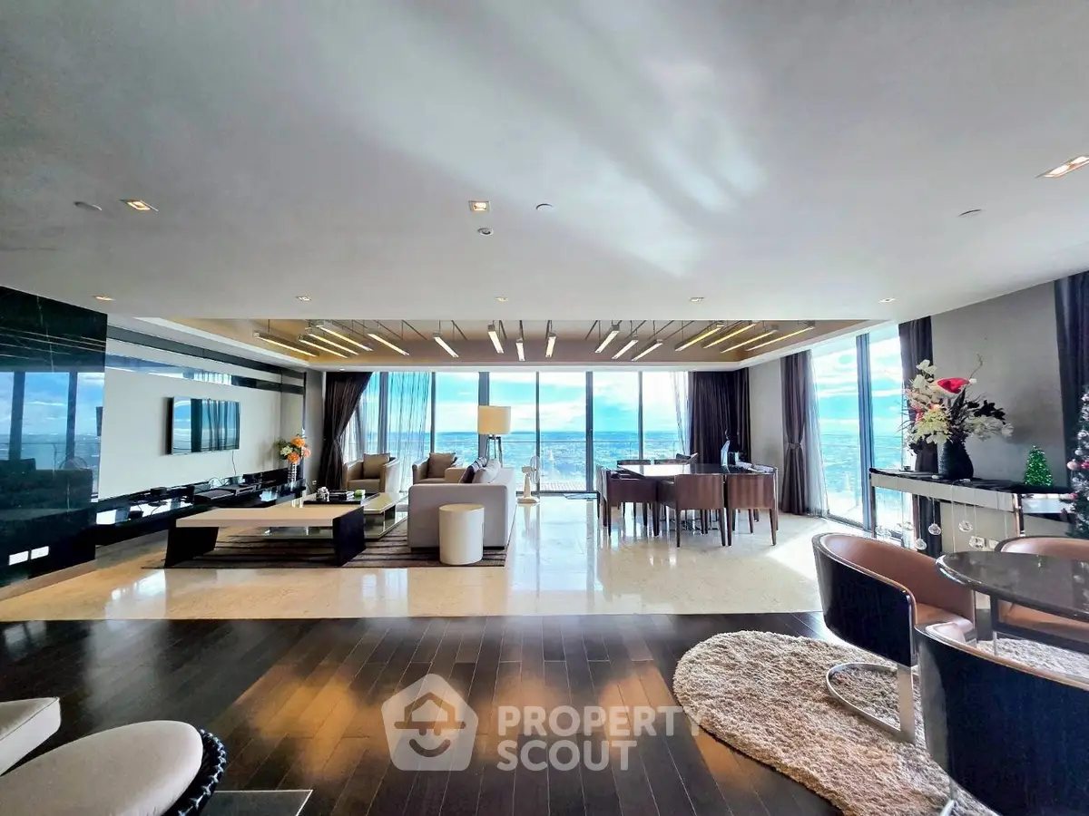 Luxurious open-plan living room with stunning ocean view and modern decor