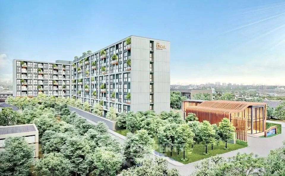 Modern residential building with lush greenery and city skyline view.