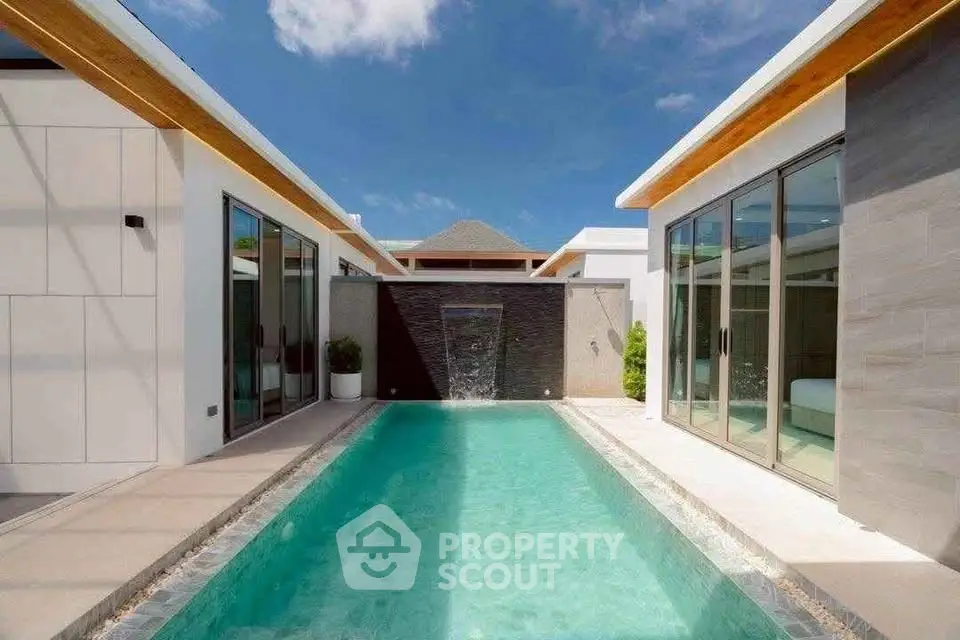 Luxurious modern villa with private pool and sleek architectural design under a clear blue sky.